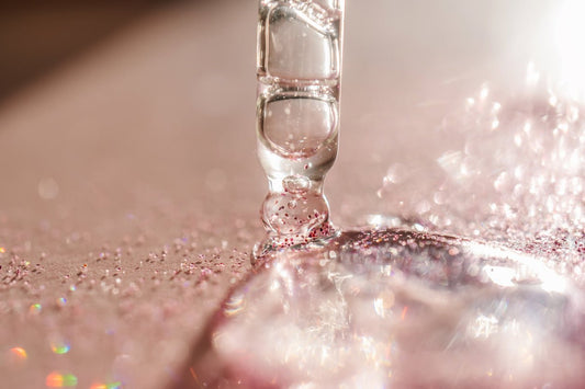 Dropper with Vitali's copper peptide serum and shimmering particles.