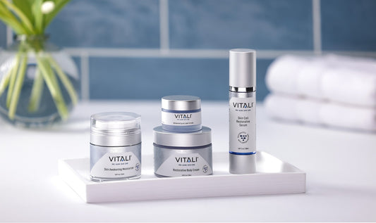 Vitali's total copper peptide body restoration line, featuring a moisturizer, eye and lash cream, body cream, and skin serum.